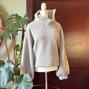 Cropped sweater with high neck side zip